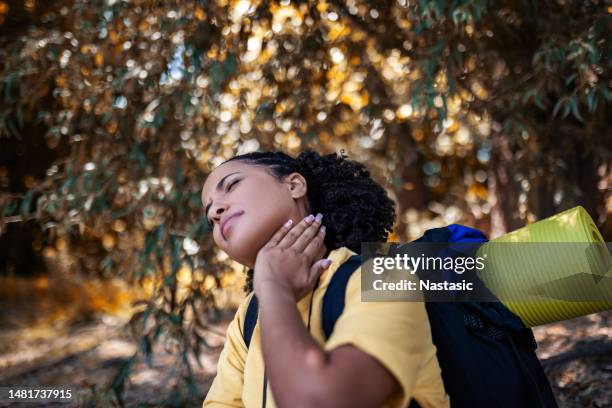 hiker in wood area having problems with mosquitos - killing insects stock pictures, royalty-free photos & images