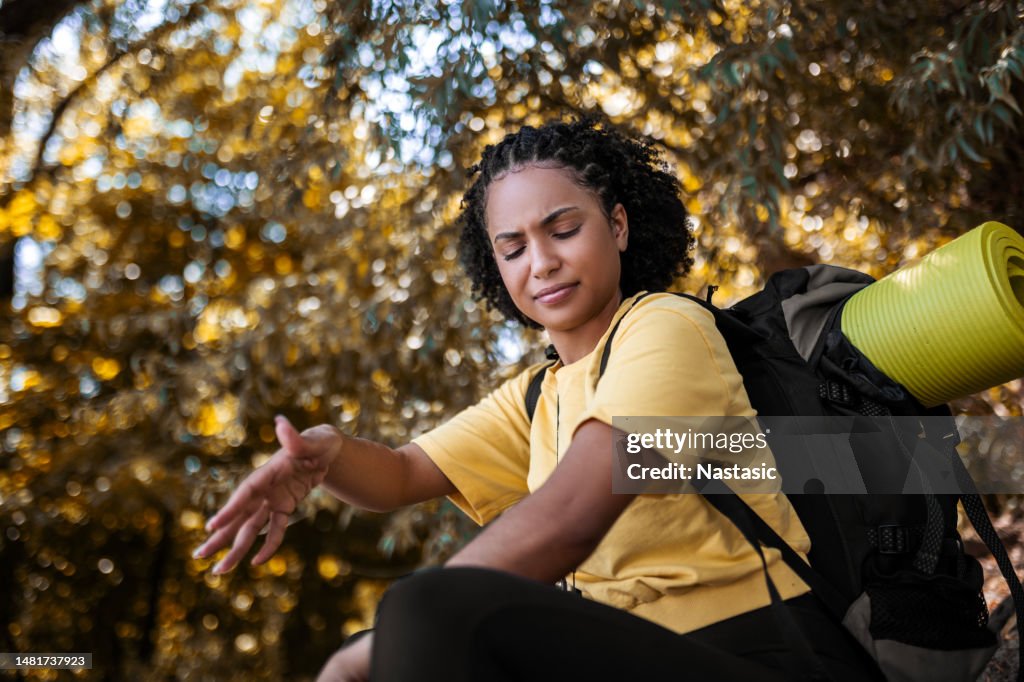 Hiker in wood area having problems with mosquitos