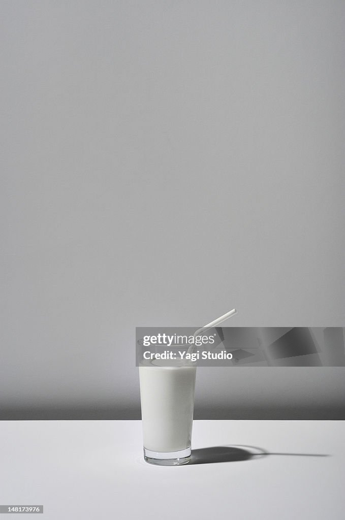 The milk which a glass contains on white backgroun