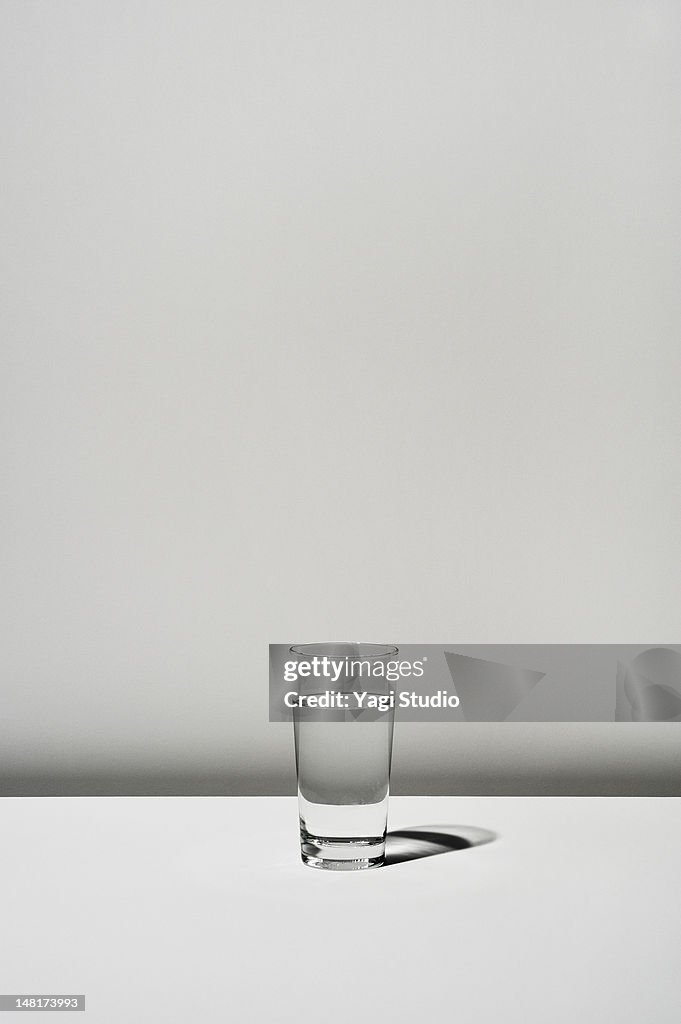 The glass which contains water on white background