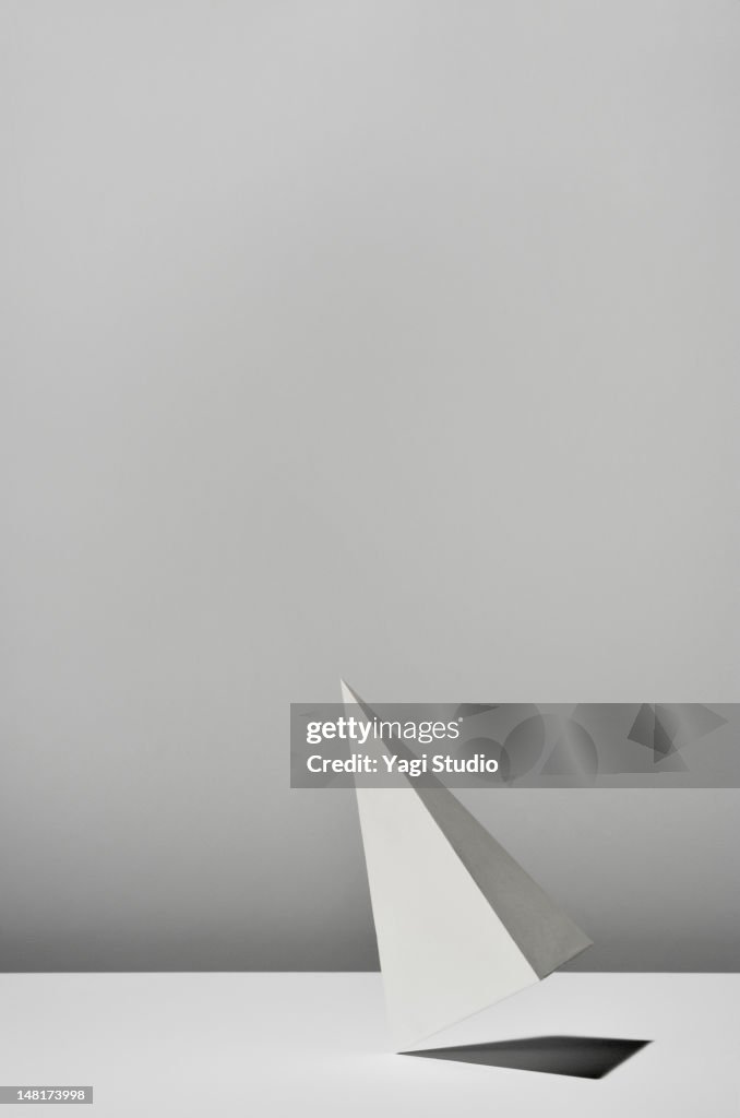 White Triangular pyramid on white background