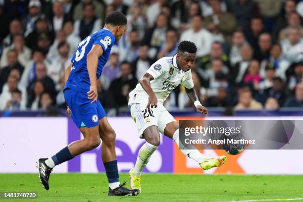 Vinicius Junior of Real Madrid shoots whilst under pressure from Wesley Fofana of Chelsea during the UEFA Champions League quarterfinal first leg...