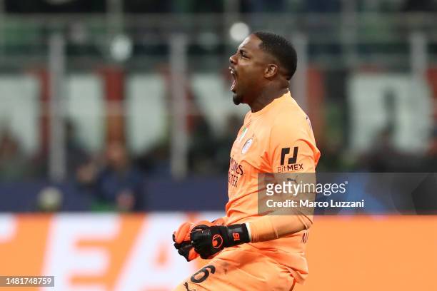 Mike Maignan of AC Milan celebrates after the teams first goal during the UEFA Champions League quarterfinal first leg match between AC Milan and SSC...