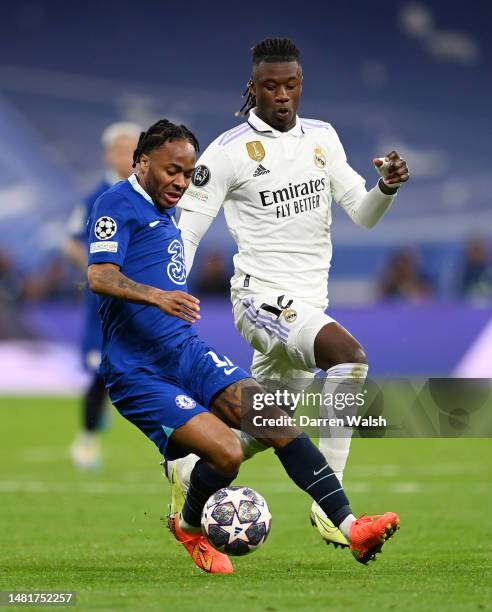 Raheem Sterling of Chelsea runs with the ball whilst under pressure from Eduardo Camavinga of Real Madrid during the UEFA Champions League...