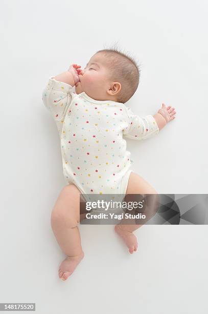 baby girl sleeping - baby on white stock-fotos und bilder