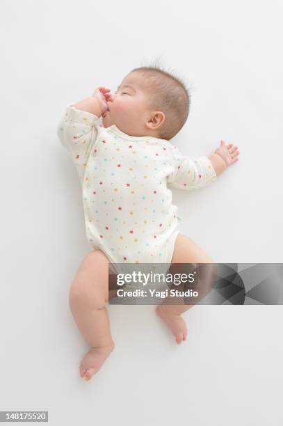 baby girl sleeping - baby white background foto e immagini stock