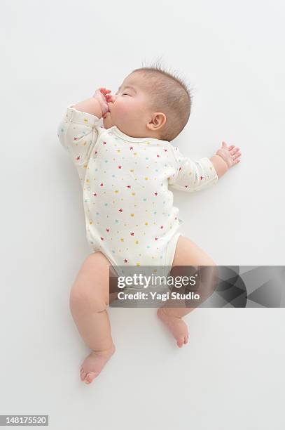 baby girl sleeping - lying on back photos stock pictures, royalty-free photos & images