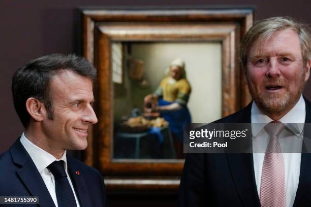 King Willem-Alexander of The Netherlands and French president Emmanuel Macron visit the Vermeer exhibition at the Rijksmuseum on April 12, 2023 in...