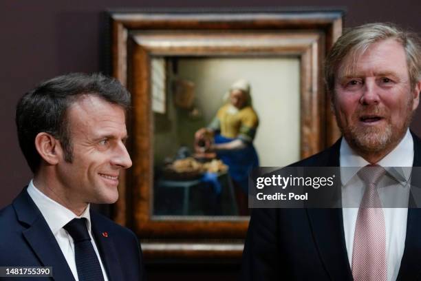 King Willem-Alexander of The Netherlands and French president Emmanuel Macron visit the Vermeer exhibition at the Rijksmuseum on April 12, 2023 in...