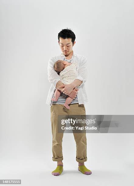 father holding baby girl - baby white background foto e immagini stock