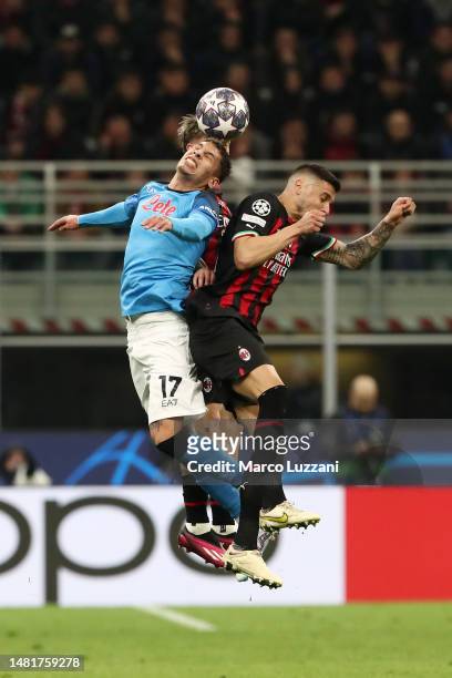 Mathias Olivera of SSC Napoli battles for a header with Rade Krunic of AC Milan during the UEFA Champions League quarterfinal first leg match between...