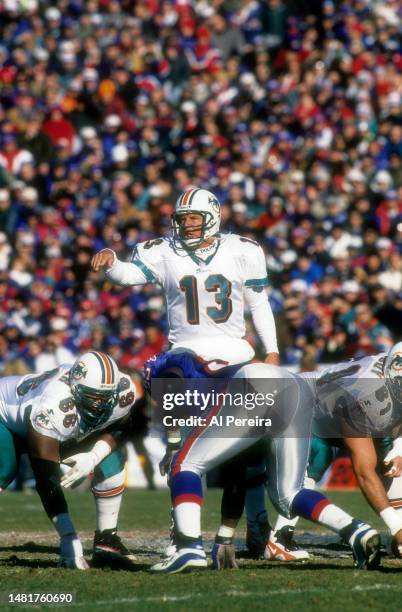 Quarterback Dan Marino of the Miami Dolphins calls a play in the NFL Wildcard Playoff Game between the Miami Dolphins vs the New England Patriots on...