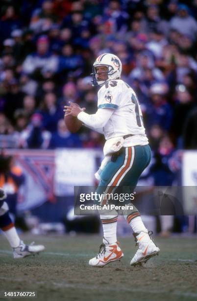 Quarterback Dan Marino of the Miami Dolphins drops back to pass the ball in the NFL Wildcard Playoff Game between the Miami Dolphins vs the New...