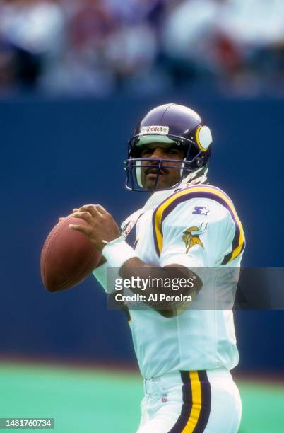 Quarterback Warren Moon of the Minnesota Vikings looks to pass the ball in the game between the Minnesota Vikings vs the New York Giants at Giants...