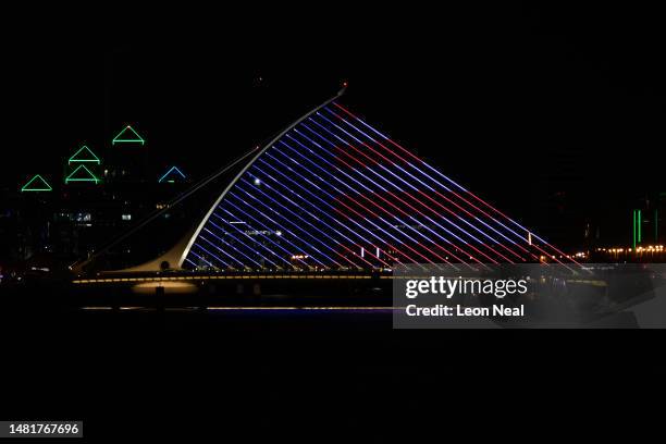 The Samuel Beckett bridge is illuminated in the colours of the flag of the United States during the visit of U.S. President Joe Biden on April 12,...