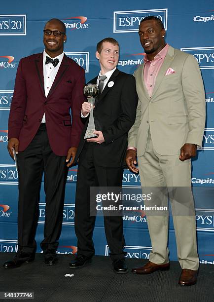 Player Vernon Davis, guest Jimmy Murphy, and NFL player Patrick Willis with award for Best Game poses in the press room during the 2012 ESPY Awards...