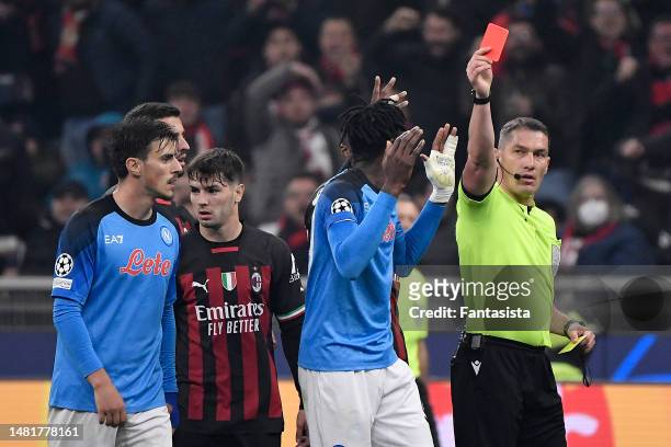 Andre-Frank Zambo Anguissa of SSC Napoli is sent-off during the UEFA Champions League quarterfinal first leg match between AC Milan and SSC Napoli at...