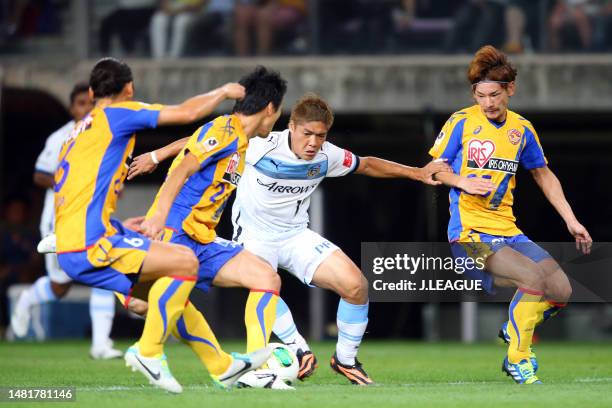 Yoshito Okubo of Kawasaki Frontale takes on Vegalta Sendai defense during the J.League J1 match between Vegalta Sendai and Kawasaki Frontale at...