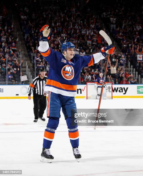 Noah Dobson of the New York Islanders celebrates a second period goal by Brock Nelson against the Montreal Canadiens at the UBS Arena on April 12,...