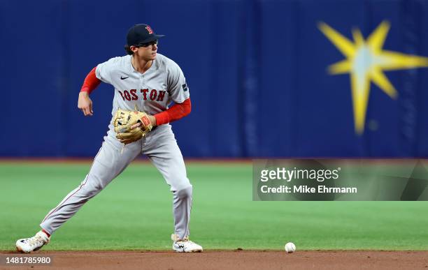 Bobby Dalbec of the Boston Red Sox makes an error in the first inning during a game against the Tampa Bay Rays at Tropicana Field on April 12, 2023...