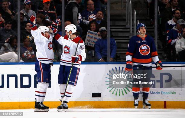 Nick Suzuki of the Montreal Canadiens celebrates his second period shorthanded goal against the New York Islanders at the UBS Arena on April 12, 2023...