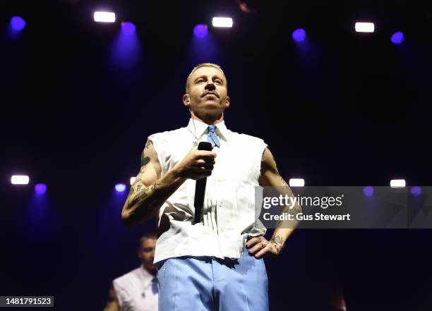 Macklemore performs on stage at the OVO Arena Wembley during 'The Ben Tour' on April 12, 2023 in London, England.