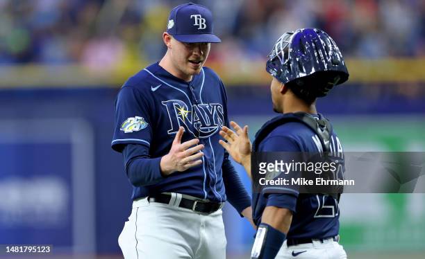 Pete Fairbanks and Francisco Mejia of the Tampa Bay Rays celebrate winning a game against the Boston Red Sox at Tropicana Field on April 12, 2023 in...
