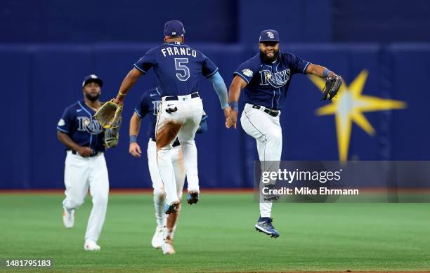 Wander Franco and Manuel Margot of the Tampa Bay Rays celebrate winning a game against the Boston Red Sox at Tropicana Field on April 12, 2023 in St...