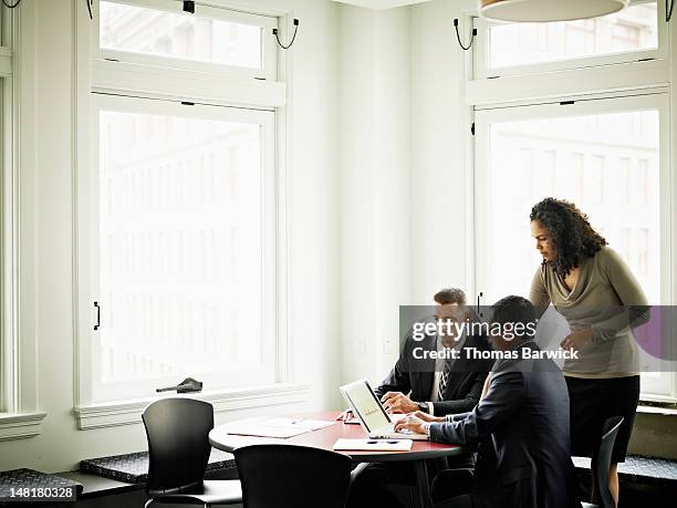 coworkers in discussion in office conference room - conference 2012 day 3 stockfoto's en -beelden