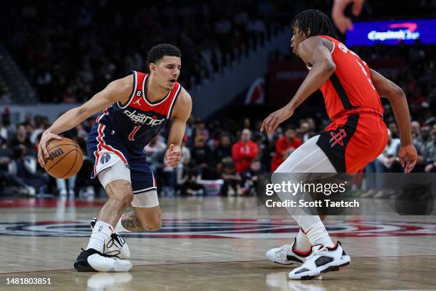 Johnny Davis of the Washington Wizards brings the ball up court against the Houston Rockets during the second half at Capital One Arena on April 9,...