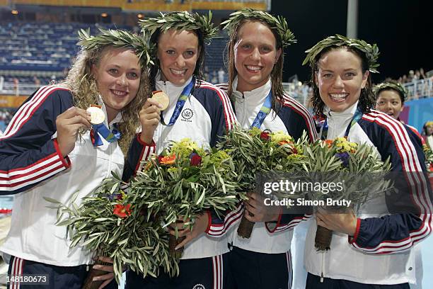 Summer Olympics: USA Kaitlin Sandeno, Dana Vollmer, Carly Piper, and Natalie Coughlin victorious with medals after winning Women's 4x200M Freestyle...