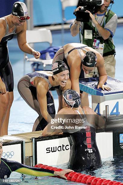 Summer Olympics: USA Carly Piper, Natalie Coughlin, Dana Vollmer and Kaitlin Sandeno victorious after winning gold during Women's 4 x 200M Freestyle...