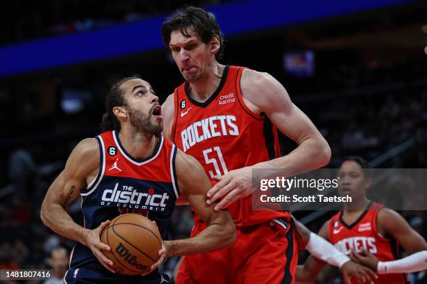 Xavier Cooks of the Washington Wizards handles the ball as Boban Marjanovic of the Houston Rockets defends during the second half at Capital One...