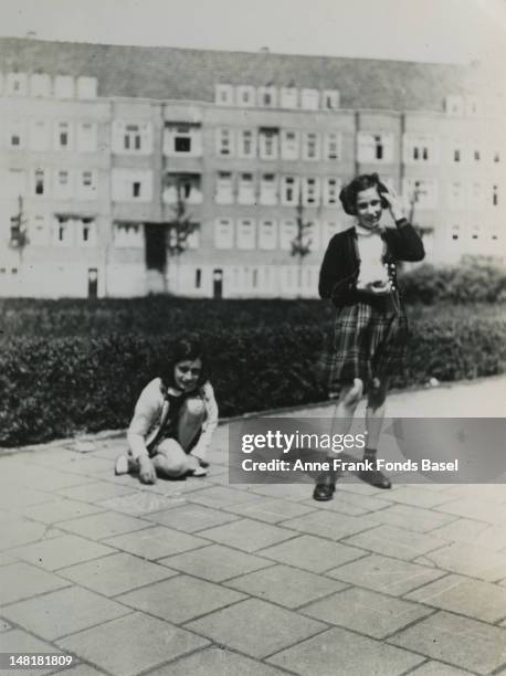 Anne Frank and her friend Hannah Goslar playing at the Merwedeplein in Amsterdam, May 1940.