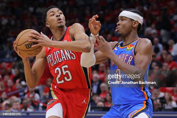 Trey Murphy III of the New Orleans Pelicans drives against Shai Gilgeous-Alexander of the Oklahoma City Thunder during the second half at the...