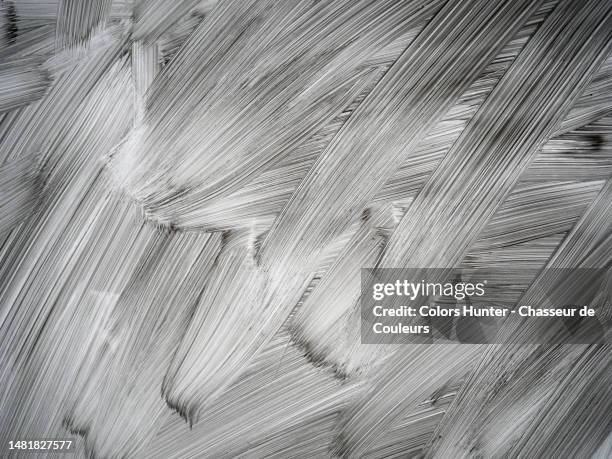 lit by a back light, layers of white paint on a window in paris, france - dirty glass stock pictures, royalty-free photos & images