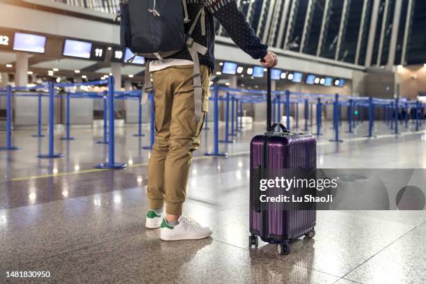 passengers are waiting at the airport terminal. - global entry stock-fotos und bilder