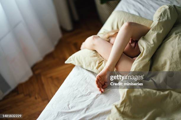 anonymous woman sleeping in bed in the morning - human eye stock pictures, royalty-free photos & images