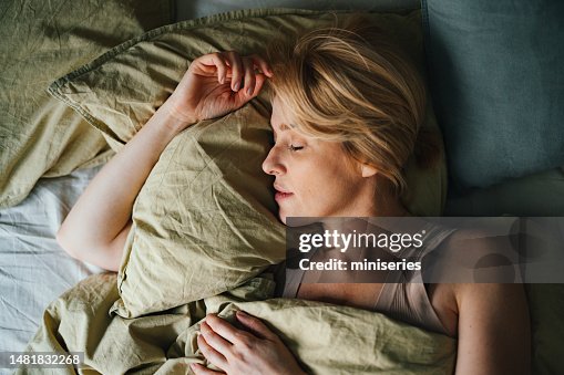 Top View of Woman Sleeping in Bed Top View of Woman Sleeping in Bed