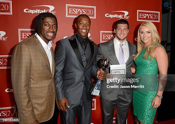 Presenter NFL player Robert Griffin III of the Washington Redskins, NFL player Demaryius Thomas and Tim Tebow of the New York Jets, and Olympic gold...