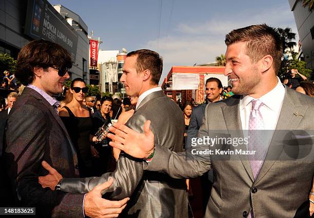Professional golfer Bubba Watson and NFL players Drew Brees of the New Orleans Saints and Tim Tebow of the New York Jets arrive at the 2012 ESPY...