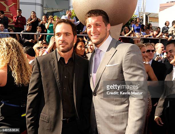Nascar driver Jimmie Johnson and NFL player Tim Tebow of the New York Jets arrive at the 2012 ESPY Awards at Nokia Theatre L.A. Live on July 11, 2012...