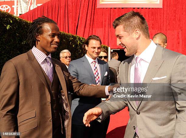 Players Brandon Lloyd of the New England Patriots and Tim Tebow of the New York Jets arrive at the 2012 ESPY Awards at Nokia Theatre L.A. Live on...