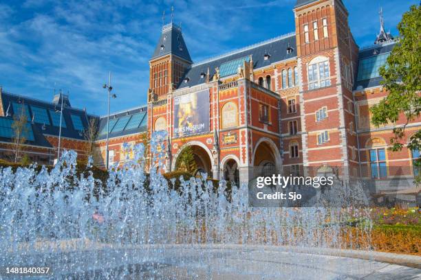 amsterdam rijksmuseum architecture in the downtown canal district during summer - rijksmuseum stock pictures, royalty-free photos & images