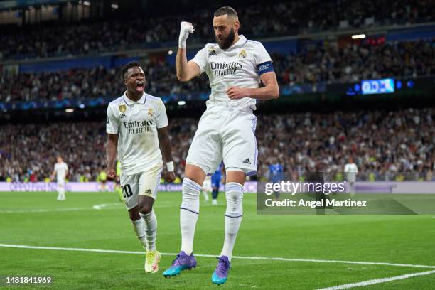 Karim Benzema of Real Madrid celebrates after scoring the team's first goal with teammate Vinicius Junior during the UEFA Champions League...