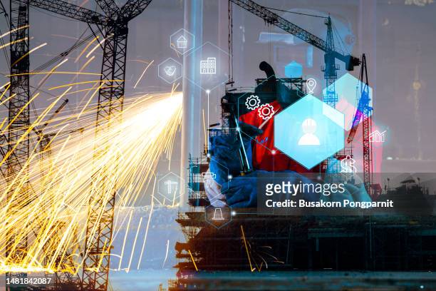 welder working on construction site with technology icons design - health and safety icons stock pictures, royalty-free photos & images