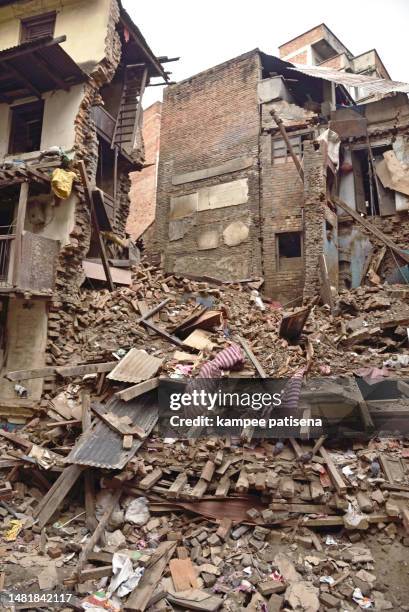 demolition of house after nepal earthquake. sankhu village which was severly damaged after the major earthquake on 25 april 2015. - wall collapsing stock pictures, royalty-free photos & images