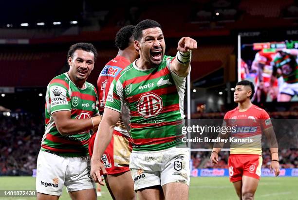 Cody Walker of the Rabbitohs celebrates scoring a try during the round seven NRL match between the Dolphins and South Sydney Rabbitohs at Suncorp...