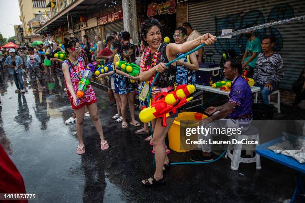 Festival goers take part in a massive water gun fight during Songkran on Khaosan Road on April 13, 2023 in Bangkok, Thailand. Songkran, the...