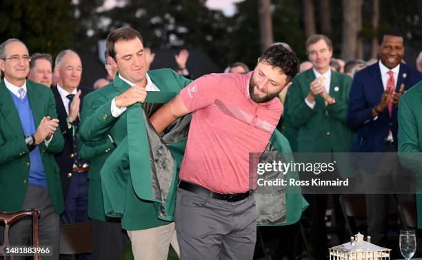 Jon Rahm of Spain is awarded the Green Jacket by 2022 Masters champion Scottie Scheffler of the United States during the Green Jacket Ceremony after...